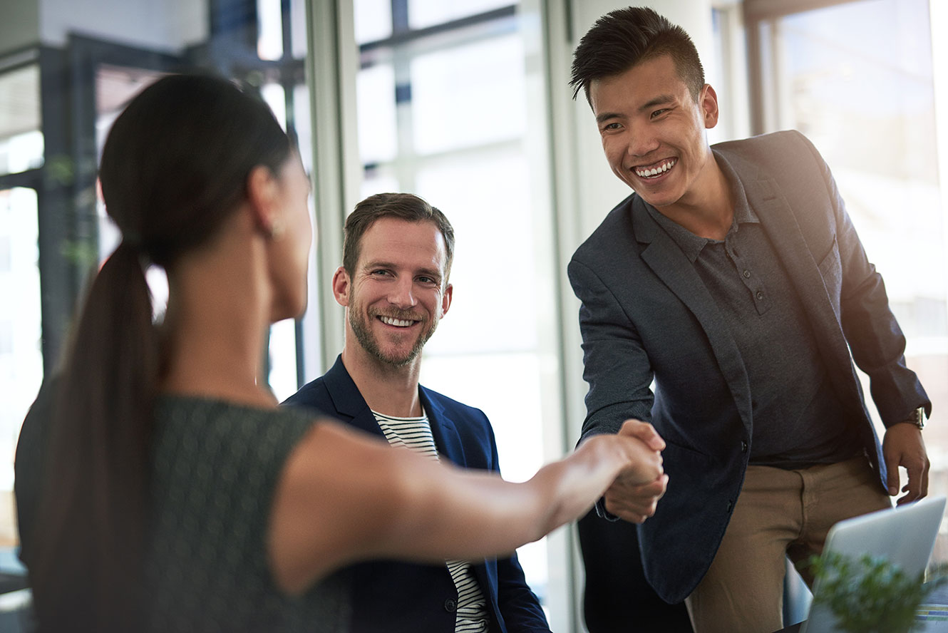 A banker shaking hands with a customer.