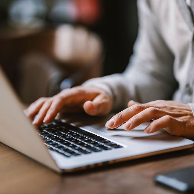 Person typing on laptop