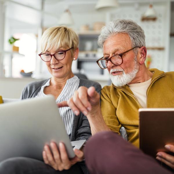 Retired couple using laptop