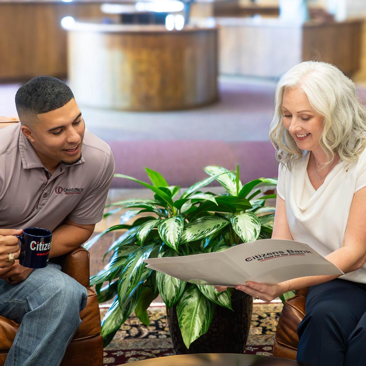 Bank employee helping business owner