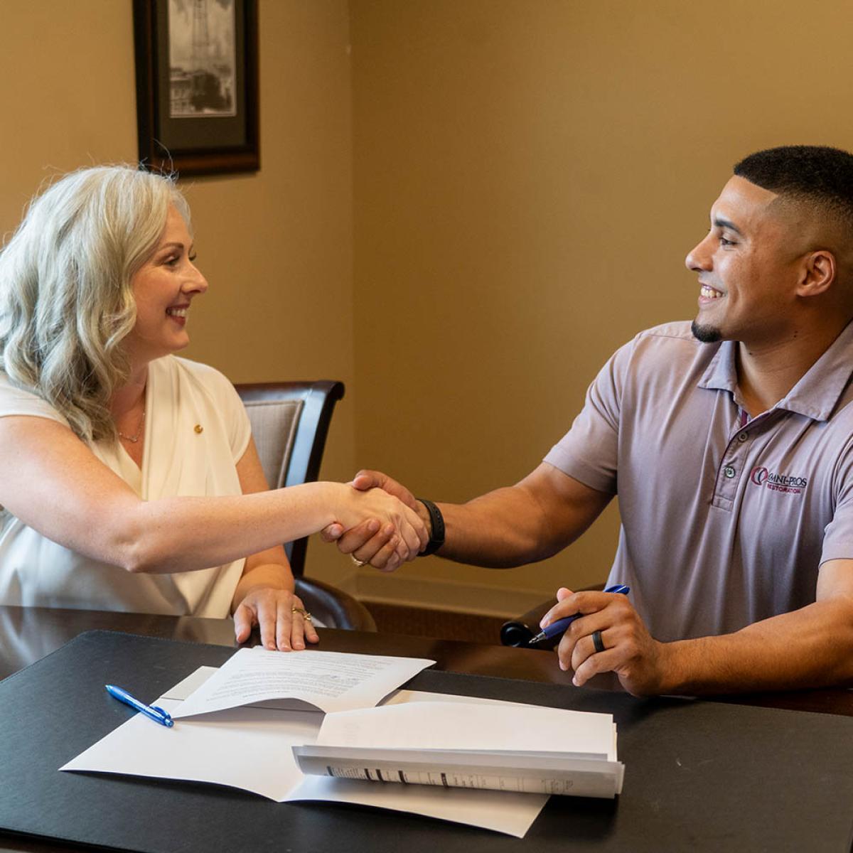 businessman shaking hands with bank employee