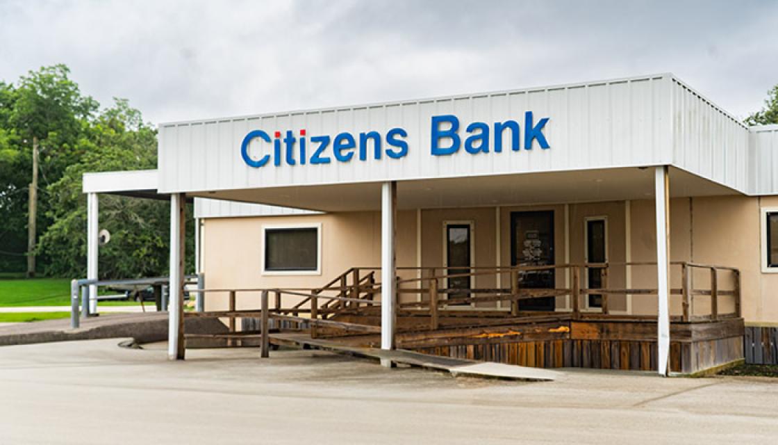 white metal building entrance with ramp